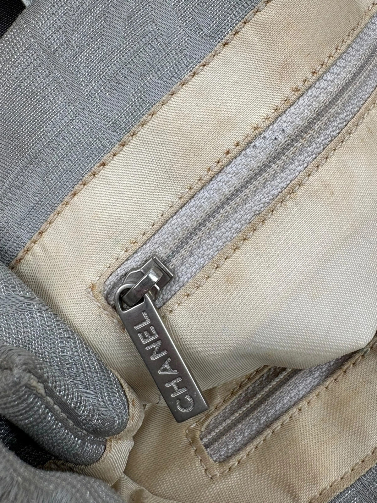 Chanel grey jacquard nylon tote with interlocking CC logo and leather shoulder straps.