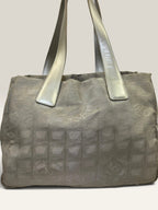 Chanel grey jacquard nylon tote with interlocking CC logo and leather shoulder straps.