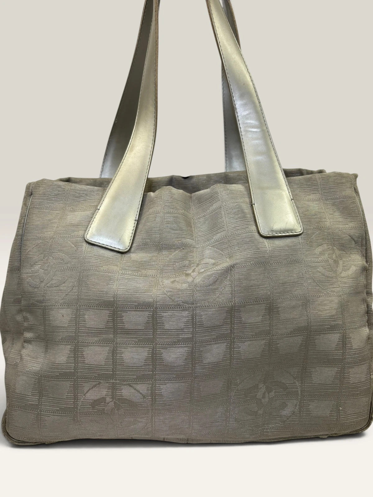 Chanel grey jacquard nylon tote with interlocking CC logo and leather shoulder straps.