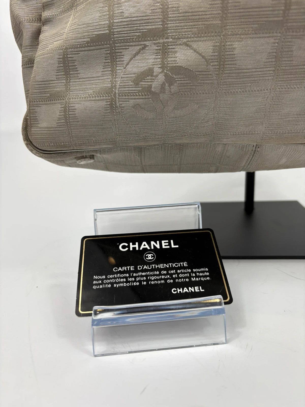 Chanel grey jacquard nylon tote with interlocking CC logo and leather shoulder straps.