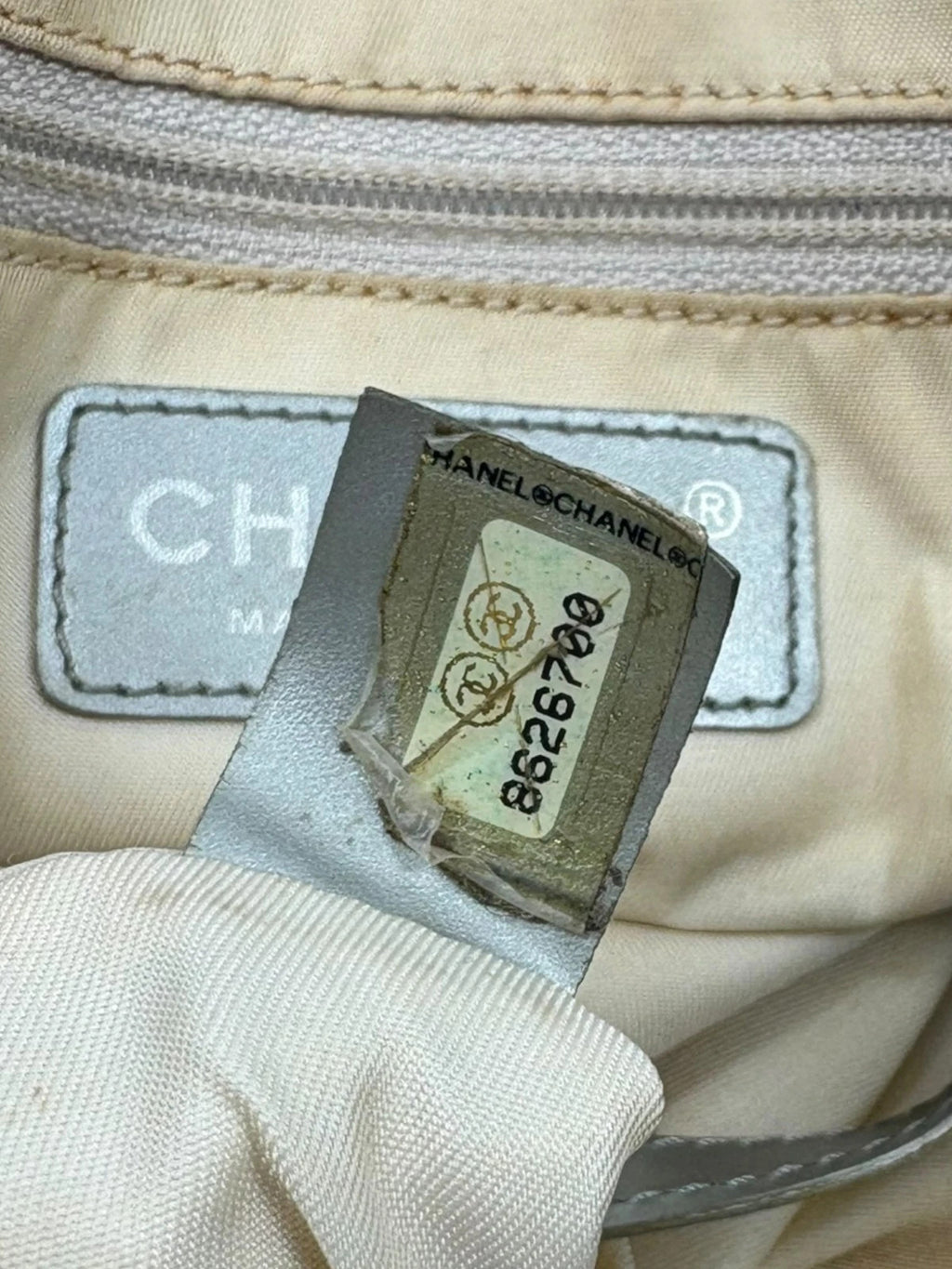 Chanel grey jacquard nylon tote with interlocking CC logo and leather shoulder straps.