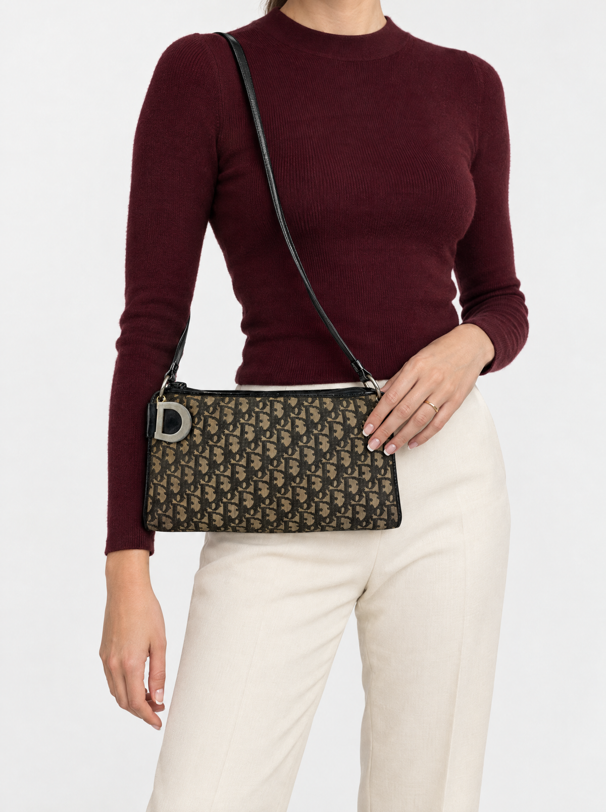 Styled photo of the vintage Christian Dior Trotter shoulder bag worn by a model