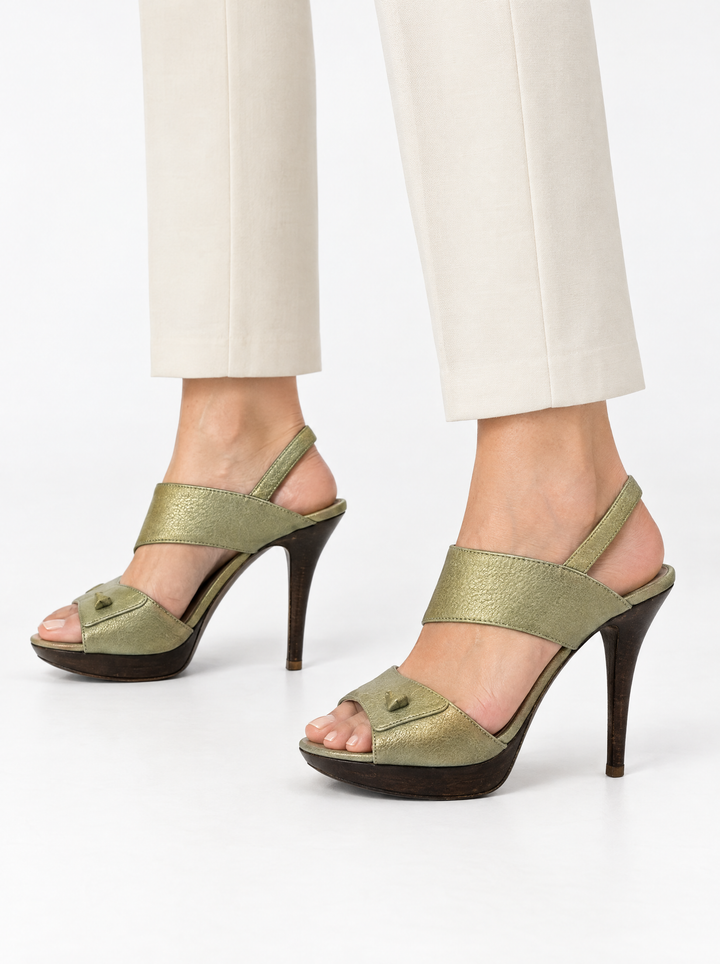 Styled photo of the vintage Salvatore Ferragamo champagne slingback heels worn by a model