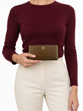 Styled photo of the vintage Bulgari brown leather purse held by a model